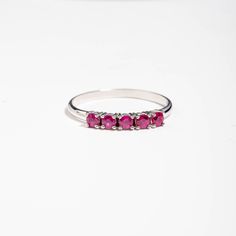 A stacking 5 stone ruby ring in 14K solid white gold. It is ideal for an anniversary gift for women or for an alternative wedding band. This dainty ruby cluster is also a great birthday gift, because ruby is the July birthstone. 100% handcrafted with love! PRODUCT DETAILS ● Material : 14K solid gold - white gold - rose gold ● Gemstones: 5 Rubies natural ● Ruby's Diameter: 2.5mm ● Rubies Weight: 0.41ct ● Gemstones shape: Round/ Brilliant cut RING SIZING For General Reference: ● we use standard US Stackable Ruby Ring For Formal Occasions, Stackable White Gold Ruby Ring, White Gold Ruby Ring With Half Eternity For Promise, Classic Stackable Ruby Ring With Round Cut, White Gold Ruby Half Eternity Promise Ring, Classic Stackable Ruby Ring For Anniversary, Classic Ruby Half Eternity Ring As Gift, Formal Stackable Ruby Ring In Sterling Silver, Classic Half Eternity Ruby Ring Gift