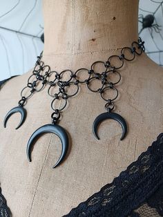 ~ A one-of-a-kind original design by Mary @ Vexed! ~ Triple crescent moon pendant necklace ~ Metal components are matte black plated brass  ~ Necklace measures 14 - 16 inches around and is adjustable ~ Closes with a lobster clasp VEXED JEWELRY: SPOOKY, BLASPHEMOUS, ONE-OF-A-KIND AND LIMITED EDITION HANDCRAFTED JEWELRY MADE WITH LOVE, SPITE, CARE, BLOOD, SWEAT, TEARS, EXPERTISE & TOP QUALITY MATERIALS SINCE 2007! Gothic Black Beads Jewelry For Festival, Black Jewelry For Halloween Alternative Fashion, Halloween Festival Jewelry With Black Beads, Black Chain Necklaces For Festivals, Gothic Black Beaded Jewelry For Festival, Metal Necklaces With Black Beads For Festival, Handmade Black Choker For Halloween, Handmade Black Metal Necklace, Unique Black Jewelry For Alternative Fashion