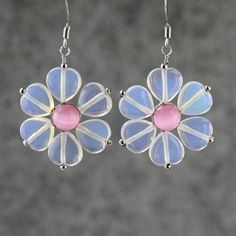 "The unique flower earrings are handmade using gemstone moonstone and pink cat eye. Free US shipping Customers who purchased this item said: \"Much prettier than the picture. The petals seem to change colors! Thank for the gift\" \"Beautiful and very well mademuch more than I expected since they are inexpensive. \" The flower is dainty and soft. It is the ultimate of femininity. The translucent quality of jade accentuate the lightness of the design. The length of the flower is 1 inch, or 2.5 cm. Pink Flower Shaped Jewelry As A Gift For Her, Pink Flower Shaped Jewelry Gift For Her, Pink Flower-shaped Jewelry As A Gift For Her, Pink Flower-shaped Jewelry Gift For Her, Pink Sterling Silver Earrings For Mother's Day, Cute Flower Shaped Jewelry With Matching Earrings, Flower Shaped Gemstone Earrings As Gift, Pink Sterling Silver Flower-shaped Jewelry, Pink Rose Quartz Earrings Gift