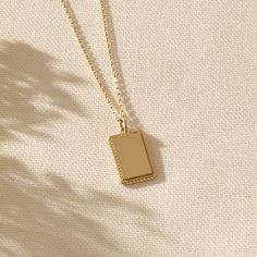 If you have something very special in your mind and want to demonstrate it all the time, our Engravable Pendant, elegantly designed and made with minimalist style, is always here to carry out and reflect your values, with an impeccable pride. - Made in 14k solid gold- Pendant, 17.35x10.25 mm / 0,68x0,40 inches- Thickness, 1.28 mm / 0,05 inches- It can be used with up to 3 mm chains. If you are to use it with a thicker chain, please let us know before you make the purchase. - This product comes w Classic Necklace With Rectangular Pendant And Delicate Chain, Minimalist Rectangular Necklace With Polished Finish, Elegant 14k Gold Necklace With Rectangular Pendant, Minimalist Cable Chain Jewelry For Everyday, Classic Yellow Gold Jewelry For Everyday Use, Minimalist Cable Chain Necklaces For Everyday Use, Classic Yellow Gold Jewelry For Everyday, Minimalist Cable Chain Necklace For Everyday Use, Elegant Personalized Jewelry For Everyday