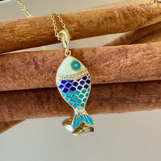 "Great workmanship, bright colors, quality material.  Pendant is covered with shiny enamels. Made with 925 sterling silver. Fish pendant does not cause allergies and does not contain nickel. Fish necklace is gold-color because it is plated on silver. A sparkling gift option for your ocean-lover friends on Christmas. If you love fish, you can take a look here for different options. https://www.etsy.com/shop/NNGJewellery?section_id=46434843 Material : 925 ct silver, enamel Weight : 2.8 gr Fish Siz Blue Enamel Necklaces With Lobster Clasp, Enamel Fish-shaped Jewelry For Gifts, Enamel Fish-shaped Jewelry As Gift, Fish-shaped Enamel Jewelry As A Gift, Fish-shaped Enamel Jewelry For Gifts, Fish-shaped Enamel Jewelry Gift, Sparkle Gift, Animal Necklace, Fish Necklace