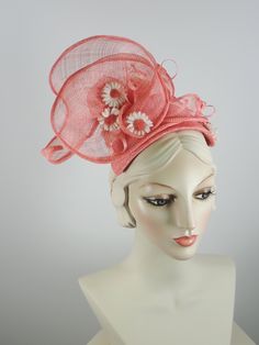 This women's peach/coral fascinator hat is a sure bet for Kentucky Derby or Kentucky Oaks. Or any summer event really, like church, ladies tea, or just for fun. It is made with sinamay straw and is very light and airy. The hand sculpted sinamay sits atop a handmade bandeau base and is secured with an elastic band that goes behind the ears and head to keep the hat in place. It is topped with vintage daisies and hand rolled sinamay leaves as well as sinamay swirls for added texture. An inner grosg Sinamay Fascinator Hat For Spring, Spring Sinamay Fascinator Hat, Spring Sinamay Fascinator, Summer Beach Fascinator, Spring Fascinator With Sinamay And Curved Brim, Red Summer Fascinator For Garden Party, Spring Adjustable Sinamay Fascinator, Spring Sinamay Mini Hats For Races, Summer Sinamay Fascinator For Races