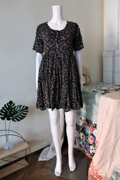 Cute True Vintage mini dress from the 1990s. Super light and airy cotton gauze fabric with a ditsy floral pattern. Lined top, short button tab, empire waist, wide skirt. Looks great with a pair of heavy boots!  Made in Nepal! ERA:  1990s BRAND: Sita COLOUR: Black, white, green, pink, lilac FABRIC: 100% cotton SIZE: Vintage size S - please check the measurements below for reference MEASUREMENTS: Pit to pit 48cm, total length 84cm CONDITION: Very good Vintage condition Vintage Outfits 90s Retro Dress, Black Floral Dress Short, Vintage Outfits 90s Retro, 90s Floral Dress, Thrift Wishlist, Lilac Fabric, Ditsy Floral Pattern, Vintage Outfits 90s, Vintage Mini Dress