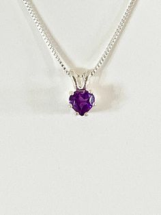 VERY TINY genuine heart shaped amethyst measures 4 x4mm (1/4 carat) and was handset in sterling silver. Sterling silver box chain is 18 inches long. Chain can be switched out to a 16 inch chain upon request. Necklace is perfect for a child or the minimalist. Comes in a gift box Purple Heart-cut Sterling Silver Necklace, Purple Heart Cut Sterling Silver Necklace, Purple Sterling Silver Heart Cut Necklace, Sterling Silver Purple Heart Pendant Necklace, Purple Sterling Silver Heart Pendant Necklace, Purple Sterling Silver Necklaces For Valentine's Day, Purple Heart Pendant Necklace As Gift, Amethyst Heart Cut Necklace For Anniversary, Purple Heart Pendant Necklace For Anniversary