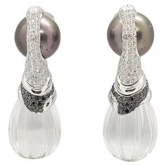 South Sea Pearl, Quartz 75.81 carats, Black Diamond 0.82 carat and Diamond 1.76 carats Earrings set in 18 Karat White Gold Settings Width: 1.7 cm Length: 5.1 cm Total Weight: 43.11 grams "We first opened doors in 1980 when it was then situated in the vicinity of the Victory Monument; a small and modest storefront with a couple of counters. From its humble beginnings to where it stands today, our company has proven its abilities as a jeweler. Since the beginning, we have been supplying fine quali Luxury Multi-stone Diamond Earrings For Formal Occasions, Luxury Multi-stone Earrings For Formal Occasions, Luxury Multi-stone Diamond Earrings For Anniversary, Luxury Diamond Gemstone Earrings For Formal Occasions, Luxury Diamond Earrings With Gemstones For Formal Occasions, Luxury Diamond Earrings With Pave Setting For Evening, Elegant Multi-stone Diamond Earrings For Formal Occasions, Elegant Multi-stone Diamond Earrings For Anniversary, Formal Luxury Diamond Earrings With Vvs Clarity