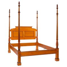 a wooden bed frame with four posts and drawers on each side, against a white background