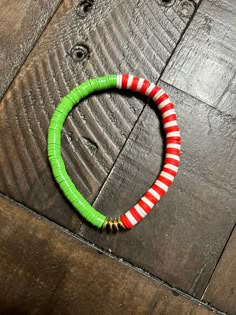 This bracelet is made with lime green, red, and white clay beads and gold disc spacers on a strong elastic string. Clay Bead Bracelet Patterns, Clay Beads Christmas, Christmas Clay Bead Bracelets, Holiday Bracelets, Clay Bead Bracelet, Christmas Clay, Clay Bracelet, Bead Ideas, Beads Bracelets