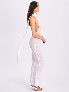 Introducing the Olena, a captivating White Burnout Velvet Animal Print Mesh Halter Neck Maxi Dress perfect for summer. This dress features a halter neck design, an alluring open back with button closures, and intricate burnout velvet detailing. The flowing maxi mermaid silhouette enhances your natural curves, while the high-stretch fabric ensures comfort and a sleek look. Ideal for beachside parties, sunset dinners, or any special occasion, the Olena dress will make you the center of attention. Satin Corset Dress, Jumpsuit And Blazer, Halter Neck Maxi Dress, Burnout Velvet, Bubble Dress, Mermaid Silhouette, Satin Gown, Trendy Prints, Halter Maxi Dresses