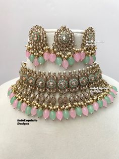 Antique Gold Polki Necklace Set comes with Stud earrings and tikka / Indian Jewelry/ High Quality Kundan and Polki Jewelry/ Bollywood Jewelry/Wedding Jewelry/Pink mint  All items are shipped from Brampton, Ontario, Canada. If you need your item by a certain day, please reach out to us for express delivery option before placing the order so that we can update the shipping for you. Standard shipping/delivery timeline Below are the delivery timeline estimates once the order ia shipped ---> USA delivery timeline * 3-5 business days to major urban centers in USA. It may take 1-2 days extra to remote locations ---> Canada delivery timeline  * 2-3 business days - GTA  & Montreal  * 2-4  business days - Rest of Ontario/Quebec * 3-6 business days-  Rest of Canada    ---> Europe/Middle East timeline Pink Meenakari Jewelry Sets For Party, Pink Jewelry Sets For Diwali Party, Bollywood Style Pink Necklaces For Party, Pink Bollywood Style Necklaces For Party, Bollywood Style Pink Necklace For Party, Pink Bollywood Party Necklaces, Pink Kundan Necklace For Festive Reception, Festive Pink Kundan Necklace For Reception, Heavy Pink Bridal Necklace For Party