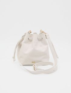 Introducing our elegant small Authenticity purse, crafted from genuine leather that exudes sophistication and timeless style. The detachable and adjustable cross body shoulder strap ensures versatile carrying options for any occasion. This bucket bag, with its two pull double cord drawstrings, is the perfect blend of luxury and practicality. ETHICALLY HANDCRAFTED BY STIVALI MEASUREMENTS: Length: 7" Width: 5" Height: 8" FEATURES/MATERIALS: Smooth leather Detachable & Adjustable cross body shoulde Card Bag, Sling Bags, Womens Purses, Shoulder Purse, Yorkie, Smooth Leather, Cross Body Handbags, White Leather, Purses And Handbags