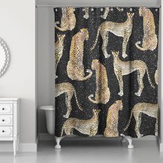 a shower curtain with cheetah and leopards on it