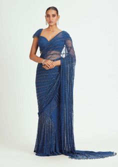 Nitika Gujral-Cobalt Blue Net Draped Sari And Blouse-INDIASPOPUP.COM Festive Blue Pre-draped Saree For Evening, Blue Draped Blouse Piece For Evening, Blue Draped Lehenga For Reception, Festive Blue Wedding Pre-draped Saree, Blue Draped Pre-draped Saree For Evening, Fitted Blue Pre-draped Saree For Festive Occasions, Blue Georgette Draped Saree, Blue Draped Lehenga With Unstitched Blouse, Blue Traditional Drape Blouse For Evening