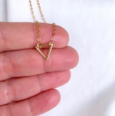 Dainty Gold Filled Triangle Pendant Necklace --- International Customers: Please be familiar with your country's policies in regards to customs fees prior to purchasing overseas. Any fees/taxes are the buyer's responsibility and may be charged at the time of delivery/pick-up. This is not included in the costs here. Thank you! Add the perfect minimalist look to any outfit with this dainty necklace. Features a mini Gold Filled Triangle Pendant adorned on a Gold Filled Link Chain. These look beauti Small Minimalist Necklace As A Gift, Small Minimalist Necklace Perfect For Gifts, Small Minimalist Necklace For Gift, Minimalist Small Necklace Perfect For Gifts, Dainty Triangle Jewelry Gift, Dainty Triangle Jewelry For Gifts, Minimalist Triangle-shaped Jewelry For Gifts, Minimalist Triangle Jewelry For Gifts, Nickel-free Minimalist Necklace