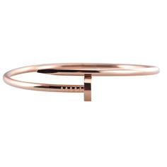 Cartier Juste Un Clou 18k rose gold nail bracelet. Comes with box and service papers. Retail $8000. DESIGNER: Cartier MATERIAL: 18k Gold GEMSTONES: None DIMENSIONS: Bracelet is Cartier size 19, width 15mm. MARKED/TESTED: Cartier, au750, 19, MAJ***. WEIGHT: 35.1 grams CONDITION: Previously Owned/Excellent Condition Modern Cartier Gold Bracelet, Formal Gold Cartier Bracelet, Luxury 14k Rose Gold Bracelet, Timeless Polished Rose Gold Bracelet, Timeless Rose Gold Bracelet With Polished Finish, Designer Rose Gold Polished Jewelry, Designer Rose Gold Jewelry With Polished Finish, Luxury Rose Gold Bracelet For Wedding, Luxury Pink Gold Bracelet For Formal Occasions