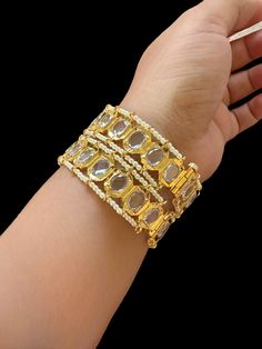 Ready to ship bangles gold plated openable with screw Cz Polki stones used fits size 2.4,2.6&2.8 Gold Openable Jewelry For Formal Occasions, Gold Plated Hand Set Bangle For Anniversary, Gold Bangle With Jewels For Weddings, Gold Jewelry With Stone Work For Anniversary, Gold Cuff Bracelet For Party, Gold Openable Bracelet For Formal Occasions, Gold Crystal Bangle Bracelet With Stones, Gold Wedding Bangle With Jewels, Jeweled Crystal Bangle Bracelet