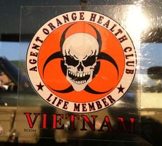 an orange health club sign with a skull on it