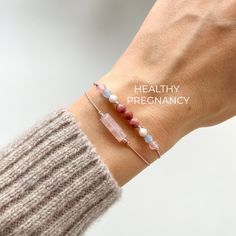 Healthy Pregnancy Bracelet - A perfect gift for new moms, this bracelet is all about bringing good vibes for a healthy pregnancy. It's a lovely way to show care to a new mom or to wear as you get ready to welcome your baby. ✦ Rose Quartz for love and care. It helps you feel loved and calm. ✦ Aquamarine for peace and bravery. It helps you stay calm and strong during pregnancy. ✦ Moonstone for connecting with your baby. It helps you feel close to your baby before they're born. ✦ Rhodonite for feeling good inside. It helps keep your emotions balanced. You can also add a Rose Quartz tube bracelet to make a pretty set. This is a wonderful gift for any new mom, whether it's her first baby or not. It's great for your wife, a friend, sister, girlfriend. Also available on a gold-filled or silver ch Adjustable Spiritual Bracelets As Gifts For Mom, Spiritual Pink Bracelets For Everyday, Pink Birthstone Bracelet For Gift, Pink Birthstone Bracelet As Gift, Minimalist Pink Hypoallergenic Bracelets, Spiritual Bracelets For Mother's Day Gift, Hypoallergenic Pink Bracelets For Everyday, Adjustable Pink Birthstone Bracelets, Adjustable Pink Bracelet Perfect As A Gift For Mom