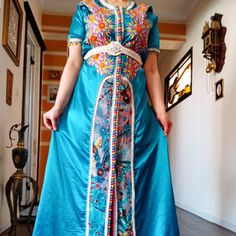 stunning Moroccan dress this authentic royal Moroccan dress is very comfortable and elegant and will turn heads at any occasion. Measurements : bust:112cm/44'' length:153cm/60'' used in a very good condition it would fit M and L as it's adjustable with the belt Bohemian Floor-length Kaftan For Traditional Ceremonies, Bohemian Floor-length Gown For Eid, Blue Bohemian Thobe For Wedding, Bohemian Long Thobe For Wedding, Bohemian Gown For Ceremonial Eid, Bohemian Ceremonial Gown For Eid, Bohemian Gown For Eid Ceremonial, Blue Bohemian Abaya For Wedding, Bohemian Wedding Abaya With Dabka