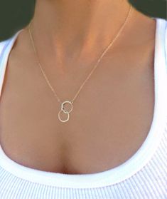 "Infinity Circle Lariat Necklace - Available in Gold, Rose Gold or 100% Sterling Silver A simple and dainty necklace ~ So simple & pretty! - 24k gold vermeil or sterling silver small circles measure about 12mm - Dainty circles attach to a shimmery 14k gold fill, sterling silver or rose gold fill chain - Total necklace length including circles is shown at 19\" - Model has size small neck - Please see measuring instructions to get the right length for you - Necklace closes with a 14k gold fill Minimalist Infinity Clavicle Chain Necklace, Minimalist Lariat Necklace For Anniversary, Simple Anniversary Necklace, Minimalist Sterling Silver Lariat Necklace As A Gift, Minimalist Lariat Jewelry As Gift, Silver Minimalist Lariat Necklace, Minimalist Lariat Jewelry Gift, Minimalist Infinity Necklace With Delicate Chain, Minimalist Sterling Silver Infinity Necklace