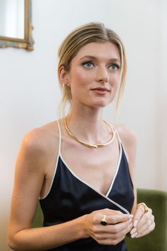 A MODERN, ELEGANT STATEMENT WHAT IT IS: A modern statement choker that adds just the right amount of drama WHY IT’S SPECIAL: A golden glint to highlight your neckline Dress up or down; it's a versatile statement maker GOOD TO KNOW: Internal Height: 114 mmInternal Diameter: 126 mm24k gold plated recycled brassHandmade by artisans in Kenya, preserving traditional techniques WHY WE LOVE SOKO: For Soko, people come first. Their jewelry brings Kenyan artisans and their traditional skills to the globa Elegant Choker Necklace For Night Out, Chic Necklaces For A Night Out, Gold Elegant Choker For Night Out, Chic Necklaces For Night Out, Gold Choker Necklace For Night Out, Chic Choker For Night Out, Elegant Gold Choker For Night Out, Chic Gold Choker, Ceremonial Handmade Gold Choker