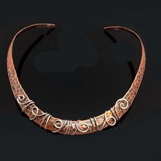 Recycled copper and sterling silver wire choker. Measures approximately 16 inches long. Fits most women. All secured wire, no glue, protective coating applied to copper to resist tarnish. Hypoallergenic and nickel free. What Are the Benefits of Wearing Copper jewelry? Wearing copper for a medicinal benefit has a long history, all the way back to ancient Egypt reports the "Gale Encyclopedia of Alternative Medicine." For those who advocate the use of copper, proposed benefits focus on reducing joi Copper Necklace Rustica Jewelry, Metalworking Jewelry, Wire Choker Necklace, Copper Choker, Wire Choker, Eco Art, Copper Bracelets, Rolling Mill, Copper Jewellery