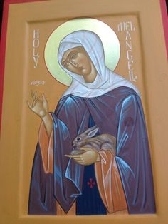 an icon of the virgin mary holding a small animal