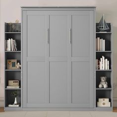 a bookcase with many books and stuffed animals