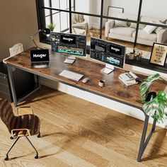 a computer desk with two monitors and a keyboard on it in front of a large window