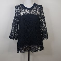 Open Back Lace Overlay Blouse. Nwot Arm To Arm 19" Length 27" Black Lace Top With Crew Neck, Party Blouse With Lace Top And Crew Neck, Chic Lace Blouse With Crew Neck, Spring Black Crochet Lace Top, Black Crew Neck Blouse For Evening, Black Lace Top Blouse With Crew Neck, Black Lace Blouse For Evening, Black Lace Evening Blouse, Fitted Black Top With Lace Work