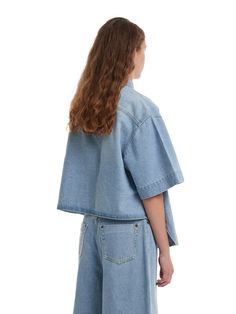 Editor's NotesTRUNK PROJEST's oversized denim shirt features a shirttail hemline. Make your outfit with this denim shirt trendy and casual.- Button closure- Spread collar- Flap pocket- Shirttail hem- Non-stretchy cottonMeasurements(in.)XXS/XS/S/L- Total length: 23.62 / 24.40 / 25.19 / 26.77 in.- Shoulder: 16.92 / 17.71 / 18.50 / 20.07 in.- Chest: 22.83 / 23.62 / 24.40 / 25.98 in.- Sleeve: 7.87 / 8.66 / 9.44 / 11.02 in.Model infoWoman - Height: 5'74 Fitting size LComposition & Care- 100% Light Wash Button-up Top With Frayed Hem, Spring Denim Tops With Pockets, Summer Collared Denim Jacket In Relaxed Fit, Spring Denim Blue Tops With Pockets, Denim Blue Tops With Pockets For Spring, Oversized Trendy Cropped Shirt For Spring, Trendy Oversized Cropped Shirt For Spring, Relaxed Fit Chambray Denim Top With Collar, Spring Denim Blue Blouse With Pockets