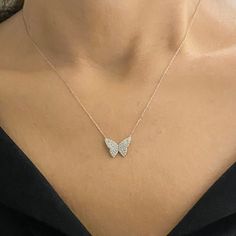 - Butterfly Necklace is made with high-quality 925K Sterling Silver. - Dainty, delicate, elegant, charm, cute and trendy butterfly pendant necklace is a good example for a CZ layered minimalist jewelry. - 925K sterling silver butterfly pendant comes with a free 925K Sterling Silver chain and decorated with white cubic zirconia stones. - You receive CZ butterfly necklace in a beautiful and free gift box - Free shipping (Arrive within 4 business days to the US and Canada ( 1 day for production + 3 Silver Necklace Butterfly, Silver Butterfly Necklace Aesthetic, Silver Chain With Pendant For Women, Butterfly Silver Necklace, Silver Prom Jewelry Necklace, Delicate White Gold Butterfly Jewelry, Delicate Butterfly White Gold Jewelry, Butterfly Shaped Sterling Silver Jewelry In Diamond White, Diamond White Jewelry With Butterfly Charm For Gift