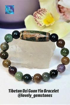 Beautiful and powerful Tibetan Dzi bracelet talisman for women. It is made of natural green Indian Agate beads in 8mm size, with focal Tibetan Agate Dzi Bead Guan Yin, which is the symbol of maternity, femininity, protection, prosperity and compassion. This green and brown protection Feng Shui amulet bracelet would be a great birthday or any holiday gift for your wife, mother, grandmother, sister, daughter, best friend or coworker or expecting mom.
Follow us on:
Ig, & Tik Tok @lovely_gemstones Dzi Bracelet, Green Jewelry Necklace, Green Stone Jewelry, Bracelet Indian, Teacher Gift Baskets, Unique Teachers Gift, Daughter Best Friend