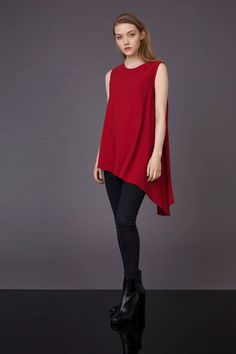 Red asymmetrical shirt, red flare blouse, asymmetrical shirt, asymmetrical blouse, Christmas top, minimalist style, gift for her Red long sleeveless blouse has a romantic silhouette , asymmetric cut which gives light and tender look. This is modern feminine top with extremely asymmetrical lower line. Prolonged left angle and flared cut allows fabric to flow in large elegant drapes and form a beautiful wavy contour. Polyester 100% Handmade item Loose fit Asymmetrical cut Flare silhouette Model is Asymmetrical Solid Color Blouse, Modern Fall Tops With Asymmetrical Neckline, Modern Tops With Asymmetrical Neckline For Fall, Fitted High-low Hem Tops For Fall, Modern Top With Asymmetrical Neckline For Fall, Modern Asymmetrical Hem Top For Fall, Elegant Tops With Asymmetrical Hem For Fall, Versatile Party Tops With Asymmetrical Hem, Elegant Fall Top With Asymmetrical Hem