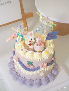 there is a cake that has been decorated with an animal and stars on the top