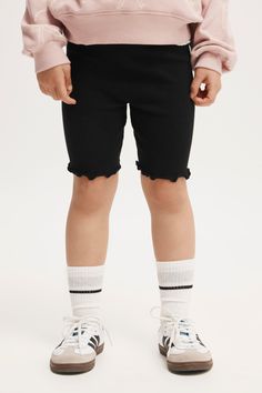 These Cute Little Biker Shorts Are Made From A Soft Stretch Cotton. They're Perfect For Sport, Gymnastics, Running And Play. The Elastic Waistband Makes Them Easy To Get On And Off, And We've Designed Them In A Range Of Colours To Suit Any Sports Uniform.Features:   -  Snug Fit   -  Mid Rise -  True Waistline -  Ultimate Comfort   -  Mid Thigh Length   -  Encased Elastic Full Width Of WaistbandComposition: Bci Cotton 95%, Elastane 5%Cotton On Kids - Hailey Bike Short - Black RibKids | Girls | Cl Casual Spring Leggings With Built-in Shorts, Cotton Biker Shorts With Elastic Waistband For Sports, Spring Elastic Biker Shorts, Elastic Biker Shorts For Spring, Casual Elastic Biker Shorts For Spring, Spring Elastic Shorts For Playwear, Spring Playwear Shorts With Elastic Fit, Elastic Spring Playwear Shorts, Spring Stretch Activewear For Play