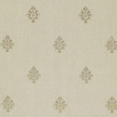 a white and gold wallpaper with an ornate design