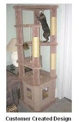 a cat sitting on top of a scratching tower