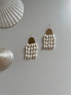 Shell Wind Chimes Earrings | Jewelry | Three Fleas Handmade Artisan Pearl Jewelry, Artisan Handmade Pearl Jewelry, Unique Pearl Dangle Earrings, Unique Dangle Pearl Earrings, Unique Pearl Drop Earrings, Handmade Pearl White Pearl Earrings, Elegant Handmade Shell Jewelry, Bohemian Mother Of Pearl Drop Earrings, Artisan White Mother Of Pearl Jewelry