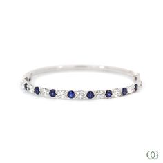 Y Classic White Gold Bangle For Wedding, Classic White Gold Wedding Bangle, Classic Blue Wedding Bracelets, Classic Blue Bracelets For Wedding, Elegant Blue Round Bangle, Fine Jewelry Stackable Diamond Bracelet For Formal Occasions, Formal Fine Jewelry Stackable Diamond Bracelet, Classic Blue Diamond Wedding Bracelet, Classic Blue Diamond Bracelet For Wedding