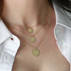 The Chiara necklace is a light gold round disc necklace that you just NEED. Wheather you wear it alone or stacked, with your another necklace or bare alone- it's perfect. Add a personal touch to your Chiara necklace with an engraved portrait of a loved one on one side and their name engraved on the opposite side. If you can dream it- we can make it happen. All features can be customized! Talk to us, we love making custom designs. Our jewelry is carefully handmade in our atelier To order by phone call +972(0)722991000 Yellow Gold Chain Necklace With Round Pendant, Circle Shaped Yellow Gold Necklace With Adjustable Chain, Minimalist Yellow Gold Medallion Pendant Necklace, 14k Gold Medallion Necklace With Round Pendant, 14k Gold Necklace With Adjustable Chain And Round Disc, Gold Circular 14k Gold Necklace, Minimalist Round Disc Jewelry With Coin Pendant, Minimalist Coin Necklace With Round Pendant, Minimalist Coin Necklace With Delicate Chain