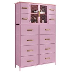 a pink cabinet with gold handles and drawers