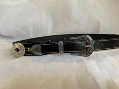 100% Genuine Leather Australian Made  This is Black leather western belt with small and big oval conchos with a Western three piece silver buckle set  , the belt is 38mm (1 1/2") and tapers down to 30mm where it buckles up , made to your requested waist size, waist size is from the buckle end of the leather to the middle hole then you will have three holes bigger and three holes smaller, just add your waist size in message to seller or message me , happy to help in custom work Black Concho Belt Buckles For Ranch, Black Belt With Antique Buckle For Rodeo, Black Concho Belt Buckles, Adjustable Western Concho Belt Buckles, Adjustable Concho Belt Buckles For Western-themed Events, Black Adjustable Belt For Rodeo, Adjustable Black Belt For Rodeo, Classic Concho Belt Buckles For Rodeo, Silver Leather Concho Belt Buckles