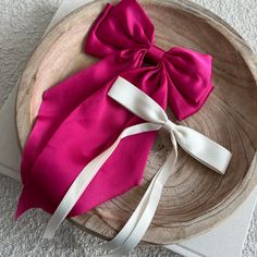 As the newest addition to our bow collection, the luxe silk bow does not disappoint. This oversized bow elevates and adds a pop to any holiday outfit. - Material: Satin - Size: 8.9(L) x 12.6(H) inches - Tight, clasping barrette closure - Designed with love in San Diego Shop the rest of our bow collection here FAQ click here Return Policy click here Chic Satin Bow With Ribbon Details, Chic Satin Bow With Ribbon, Chic White Bow For Party, Chic Satin Bow For Party, Chic Evening Bow Tie With Satin, Chic Satin Bow For Formal Occasions, Chic Satin Bow Tie For Evening, Chic Evening Satin Bow Tie, Chic White Satin Bow