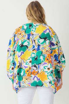 Turn heads in this floral print top! Featuring an asymmetrical sleeve hem and a flattering v-neck, this lightweight woven top is perfect for any occasion. With a button up front and non-sheer fabric, you'll feel confident and stylish. Don't be afraid to bloom in this playful and chic top. Size and FitModel is 5'9" and wearing size Extra Large. Vibrant Print V-neck Top For Brunch, Multicolor Floral Print V-neck Blouse, Trendy Vacation Blouse With Abstract Print, Trendy Blouse With Abstract Print For Vacation, Oversized Floral Print Blouse, Floral Print Rayon V-neck Top, Patterned Flowy V-neck Blouse, Multicolor Rayon Blouse For Spring, Summer Flowy Printed Blouse