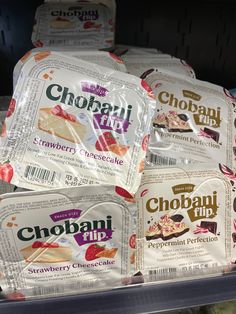 several packages of chobani pie are stacked on top of each other in a refrigerator