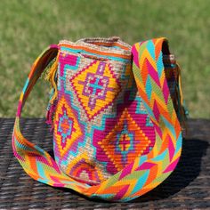 Colorful & unique crochet bag, hand-woven by talented Wayuu artisans in La Guajira Colombia. It takes approximately 20 days for a Wayuu woman to knit one bag, and each design is inspired by nature and her own culture knowledge, so every handbag is one of a kind! Very lightweight, durable and comfortable to carry on. Wear it as a cross-body or shoulder bag. This stunning boho style bag is perfect for a casual day, as a beach/pool accessory or as a complement to your sports outfit. Details: The ba Multicolor Crochet Satchel For Vacation, Multicolor Crochet Satchel Bag For Vacation, Eco-friendly Multicolor Festival Bag, Daily Use Multicolor Woven Crochet Bag, Multicolor Handwoven Shoulder Bag, Multicolor Handwoven Crochet Bag For Daily Use, Handwoven Multicolor Crochet Travel Bag, Multicolor Crochet Weaving Travel Bag, Multicolor Crochet Pouch Bag For Vacation