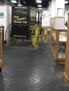 an old fashioned wagon is on display in a museum