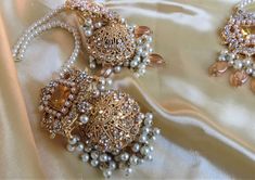 A must have for the upcoming wedding season! This bridal set is a unique blend of royal and modern with its pastel hues and gold plating. The set is gorgeous with pearls and is a full bridal piece but can be worn separately for a lighter and simple look. Set includes: mala , earrings, maang tikka , passa, choker In stock and ready to ship‰Û? Elegant Jhumkas For Wedding And Eid, Elegant Jhumkas For Wedding On Eid, Elegant Gold Sets For Reception, Elegant Wedding Jhumkas For Eid, Elegant Bridal Sets For Eid, Bollywood Style Gold Wedding Sets, Gold Bollywood Sets For Wedding, Tilla Bridal Earrings For Eid Wedding, Tilla Bridal Earrings For Wedding And Eid