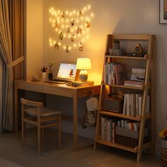 a desk with a laptop on it next to a book shelf