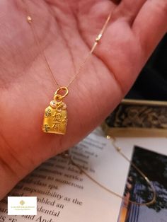 Gift yourself or your love once this   Pure Gold Auspicious Necklace. Crafted with pure 24 Karat Pendant gold and 18K Gold Chain. *Material: 24 K Pure Gold Pendant/18K Chain *Pendant Length: Approximately 17.7mm (w/hook) , 14.3mm (w/o hook) *Pendant Width: Approximately 9.1mm *24K Pendant Weight: Approximately 1g *18K Chain Weight: Approximately 1.30g ;  *18K Chain Leng5h: Approximately 18 Inches  *18K Chain Width: Approximately .5mm 🍁HALLMARKED. NOT GOLD FILLED. NOT GOLD PLATED. NOT GOLD VERME Gold Locket Necklace For Gifts, Yellow Amulet Necklace, Perfect For Gifts, Gold Amulet Necklace For Good Luck, Yellow Amulet Necklace For Gift, Yellow Amulet Necklace As Gift, Gold Necklaces With Charms And Square Pendant, Gold Necklace With Charms And Square Pendant, Yellow Gold Locket Necklace For Blessing, Gold Clavicle Chain Charm Necklace As Gift